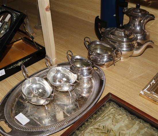 A four piece silver plated tea set tray and two sauceboats